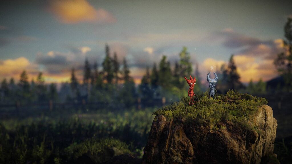 Unravel 2 gameplay showing Yarnys swinging through a forest.