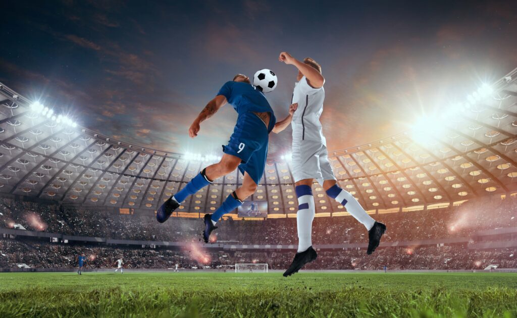 Two soccer players in action during a high-stakes match in a professional stadium, symbolizing the excitement of FIFA Coins EA FC 24 gameplay.