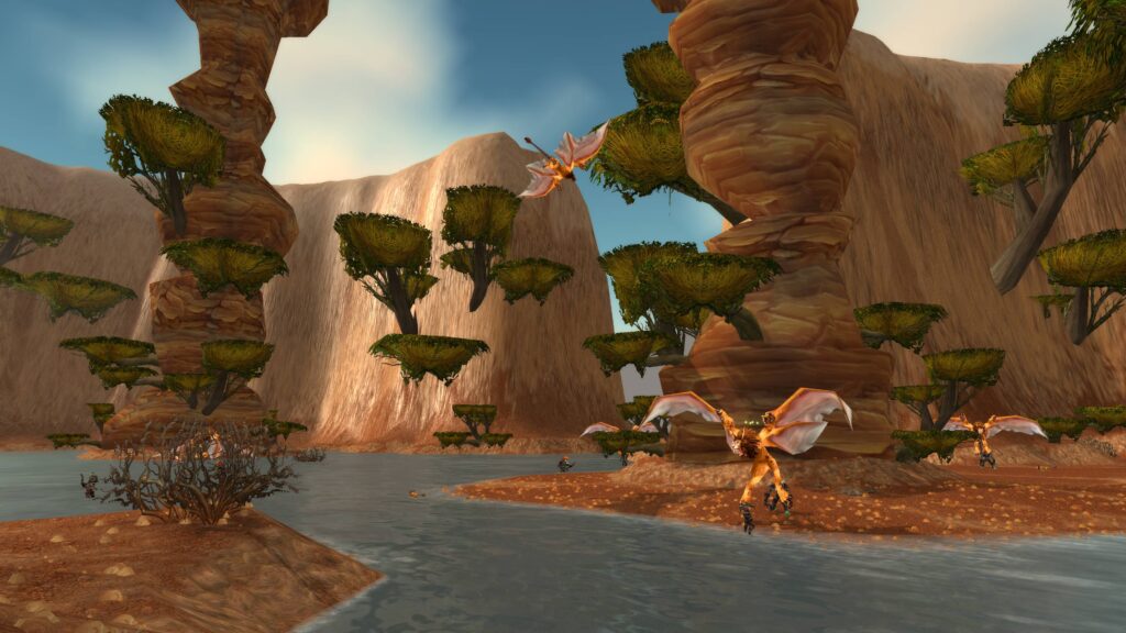 Buy WoW gold Cataclysm Classic - Thousand Needles zone with towering rock formations and lush greenery.